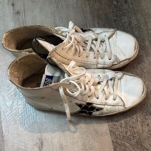 Golden Goose Francy distressed leather high-top sneakers in white.